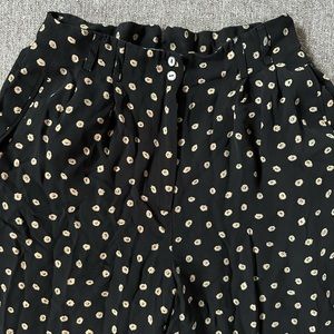 Black floral trousers